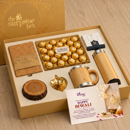 7_Eco-Friendly Diwali Kits Open gold gift box revealing Ferrero Rocher chocolates and festive items for Diwali on a wooden surface